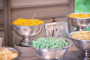 Popcorn bar filled with yellow and green popcorn.